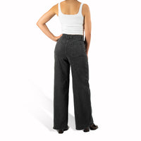 woman wearing murjer morrison  shapewear wide leg jeans in washed black color with built-in tummy control and better butt lifting technology. back view