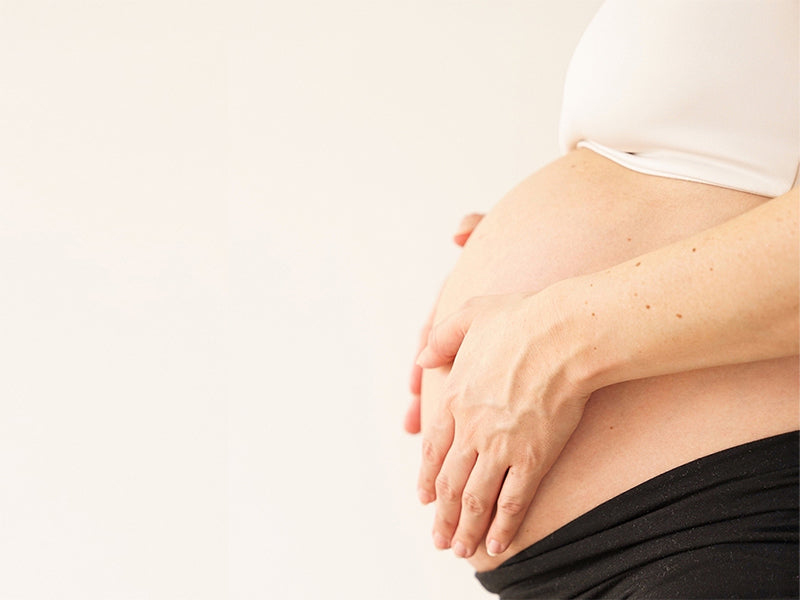 picture of pregnant woman with her hands resting on top of her belly in a holding action. the compression in murjer™ foundation brief can help a recovering postparum belly by providing support to muscles that have been overstretched and overworked from pregnancy and labor. foundation brief can also reduce up to 3" in your waist size.
